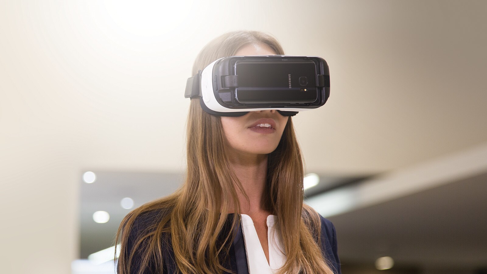A woman wearing a VR headset.